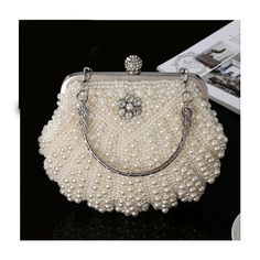 Pearl White Beaded Shoulder Bag For Party, Pearl White Shoulder Bag For Wedding, Vintage Party Clutch With Pearl Handle, Pearl White Beaded Clutch For Evening, Pearl White Handheld Bags For Party, Elegant Pearl White Shoulder Bag For Party, Pearl White Beaded Evening Bag For Party, Embellished Clutch For Banquet, Elegant White Coin Purse