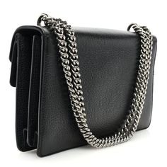 This is an authentic GUCCI Pebbled Calfskin Small Dionysus Shoulder Bag in Black. This bag is crafted of pebbled black calfskin leather with an aged silver chainlink shoulder strap and a crystal-encrusted, aged silver horseshoe with tiger heads at each end. The bag opens with a concealed press lock to a front flap pocket and a partitioned natural fabric interior with a center zippered pocket. Gucci Bag Dionysus, Gucci Crossbody Bag, Gucci Crossbody, Small Messenger Bag, Gucci Monogram, Vintage Monogram, Gucci Shoulder Bag, Tiger Head, Natural Fabric