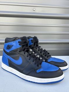 Elevate your sneaker game with these Jordan 1 Retro High OG Royal 2017 sneakers. These shoes are perfect for any occasion, whether it's activewear or casual wear. The black leather upper material and solid pattern make these sneakers versatile yet stylish. Featuring a lace-up closure and high-top shoe shaft style, these sneakers offer both comfort and ankle support. The rubber cleat type and outsole material provide durability and traction for gym and training activities, track and field, walking, skateboarding, yoga, and basketball. These Air Jordan 1 Retro High OG Royal 2017 sneakers are a must-have for any sneakerhead. Comes with replacement box High-top Custom Sneakers For Training, Casual High-top Jordan Shoes For Training, Leather Training Sneakers With Round Toe, Casual Lace-up Training Sneakers, Low-top Jordan Shoes With Contrast Sole For Sports, High-top Basketball Shoes With Contrast Sole, High-top Basketball Shoes With Contrast Sole For Sports, Custom Low-top Training Sneakers, Leather Basketball Shoes With Contrast Sole For Light Sports