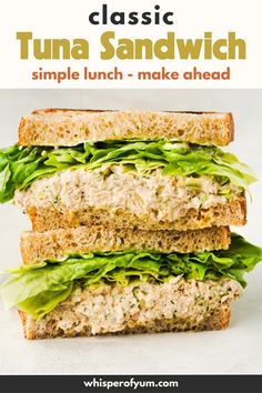 a sandwich with tuna and lettuce is stacked on top of each other in front of the words, classic tuna sandwich simple lunch - make ahead