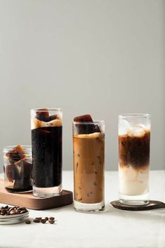 three different types of drinks on a table