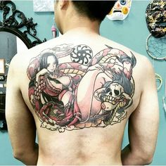 a man with a tattoo on his back