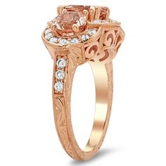 a rose gold ring with an oval cut diamond in the center