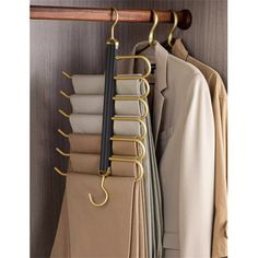 an organized closet with folded clothes and coat hangers