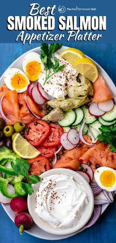 a white plate topped with lots of different types of vegetables and eggs on top of it