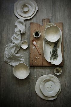 various bowls and spoons on a wooden table