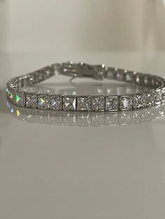 ***This bracelet is also on Promotional Sale Right Now at 30% Off!***Solid Sterling Silver 925 with the finest 4mm 5A CZ Diamonds.***The bracelet is absolutely gorgeous, it is fresh just came out from our studio! ****Once you put it on, you’re not gonna want take it off!! It is incredibly comfortable ***Will Come in a box(one per package). Let me know if you have specific request please!Base:   Solid Sterling Silver 925Finish: White Gold Stone: 5A CZ Diamonds —————————————————————-* We accept re Elegant Princess Cut Tennis Bracelet For Anniversary, Formal Cubic Zirconia Tennis Bracelet With Princess Cut, Formal Cubic Zirconia Princess Cut Bracelets, Formal Princess Cut Cubic Zirconia Bracelets, Formal Princess Cut Cubic Zirconia Tennis Bracelet, Classic Princess Cut Tennis Bracelet For Wedding, Classic Cubic Zirconia Tennis Bracelet, Classic Rectangular Cubic Zirconia Tennis Bracelet, Classic Silver Rectangular Tennis Bracelet