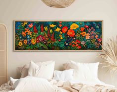 a large painting on the wall above a bed