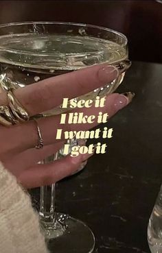 someone holding a wine glass with the words i see it like it, i want it i got it