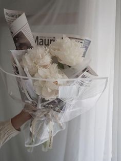 a bouquet of flowers is wrapped in plastic