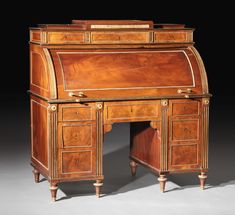 an old fashioned wooden desk with drawers