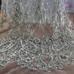 Price: The price is for 1 yard. if you buy more than 1 yard, it won't be cut. will come in one piece the longest is 20 yards. Material: polyester, sequins, beads Fixed Wide : 130cm or 51 inches. color: Silver Want to see other colors and more similar Beading lace fabrics come to: https://www.etsy.com/shop/Randyfabrics?ref=hdr_shop_menu&section_id=14192305 Shipping: Choose the shipping way you need, if you want the package shipped by express, please note the phone number on order. Use for Dre Silver Embellished Lace For Party, Silver Embroidered Lace For Party, Glamorous Silver Dress With Intricate Embroidery, Fitted Silver Lace For Party, Silver Sequined Lace Dresses, Elegant Silver Lace Embroidered Fabric, Elegant Silver Embroidered Lace Fabric, Elegant Silver Lace With Sequins, Silver Embroidered Fitted Fabric For Wedding