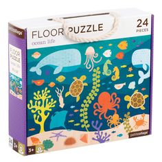 a puzzle box with an ocean scene and sea animals on the bottom, in purple