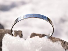 "- Sterling Silver Engraved Bracelet - With your one of kind quote or saying - Text, symbols, coordinates or handwriting outside and inside the cuff (secret message) - Many fonts and symbols available - Mat or shiny finish - Approximately 8 mm wide - A minimal, elegant design - Looks great individually - or stacked together with other bracelet Please give me all the details in the \"personalization\" field while ordering. Size Women's standard size measures 6-6,5 inches long and fits most teen a Engraved Adjustable Symbolic Cuff Bracelet, Engraved Silver Cuff Bracelet With Meaningful Style, Adjustable Engraved Cuff Bracelet With Meaningful Style, Silver Engraved Text Bracelet, Symbolic Silver Engraved Cuff Bracelet, Silver Engraved Bracelet, Engraved Bracelet, Custom Bracelets, Paper Decorations