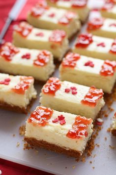 there are many small pieces of cake on the plate and one is decorated with pomegranates