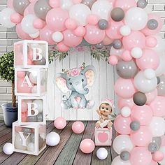 an elephant themed baby shower with balloons