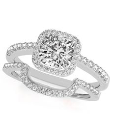 a cushion cut diamond ring with pave set shoulders