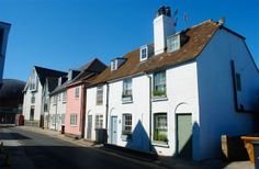 a row of houses on the side of a road