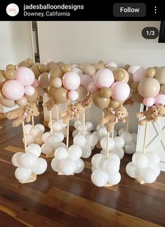 balloons are arranged in the shape of animals on sticks