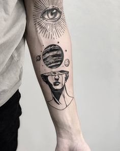 a person with a black and white tattoo on their arm