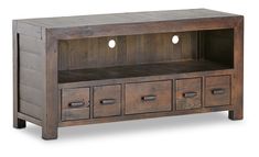 a wooden entertainment center with drawers on one side and two lights on the other end