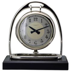 an alarm clock is sitting on a stand