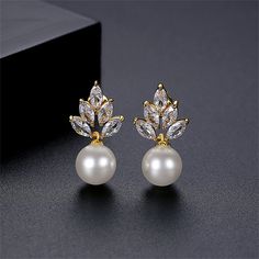 Leaf-shaped marquise crystals, 18k gold-plated details and a pearl adds charming accent. 0.35" W x 0.91" L 18k gold-plated copper / crystal / pearl Copper Crystal, Girl Accessories, Elegant Girl, Pearl Crystal, Shell Earrings, Accessories Jewelry Earrings, Crystal Pearls, Pearl Drop Earrings, Pearl Drop