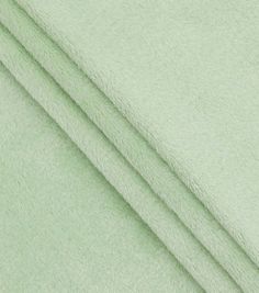 three pieces of light green fabric folded together