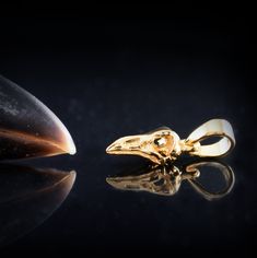 ** If we were happy with our 14k and 18k solid gold little raven skull, we are excited about the new gold little raven pendant! The quality of the bone textures in gold is even more spectacular!   The work process is 100x100 handmade. First, the wax carving was done manually, without machines or 3D printers. Beauty is in the imperfection of the human hand. I then work directly on the metal (18 and 14 karat gold) to achieve different finishes and textures. Each piece is different, each piece is u Skull Christmas, Raven Pendant, Crow Skull, Viking Culture, Viking Pendant, Claw Ring, Raven Skull, Wax Carving, Gold Skull