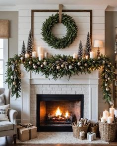 a living room decorated for christmas with candles and wreaths on the fireplace mantel