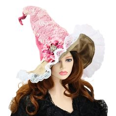 This pink rose and lace Fairy Godmother witch hat is ready for a festival, a renfaire costume, a convention, role play, or even an accent for your nursery. Elegant with a touch of granny-core fun, I felted the lace doily right into the hat, giving it an antiqued wrinkled vibe. The quality suede brim is wired and edged with ruffled lace, and you can shape it at will. The soft old fashioned pink rose has a vintage-look rhinestone butterfly nestled in the petals, for that touch of cottage fairy garden. The tip is wired so you can curl or angle just so. Soft to wear, but firm enough to hang on a peg or sit on a table. I created the material for this hat by hand felting deep dyed fine merino together with the doily, so it is full of visual texture, and lightweight. Hand felting gives this hat n Pink Wide Brim Costume Hat For Festival, Whimsical Pink Costume Hats For Carnival, Whimsical Pink Costume Hats And Headpieces For Carnival, Pink Whimsical Costume Hats For Carnival, Pink Halloween Costume Hat, Pink Adjustable Costume Hat For Carnival, Adjustable Pink Costume Hat For Carnival, Adjustable Pink Carnival Hat, Adjustable Pink Halloween Costume Hats And Headpieces