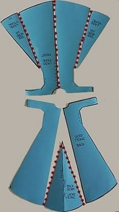 three pieces of blue paper with red stitching on the sides and one piece cut out