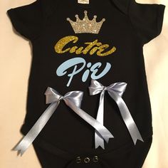 Love This One!!!! Super Gorgeous & Beautiful The Colors Are Black, Silver, Gold & Baby Blue. The Crown Is Everything!!! Made By Lnj Designs. Black Cotton Onesie For First Birthday, Cute Black Onesie With Letter Print, Cute Black Short Sleeve Onesie, Playful Black Top For First Birthday, Playful Black Tops For First Birthday, Cute Black Top For First Birthday, Cute Black Tops For First Birthday, Lisa Black, Gold Baby