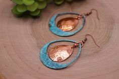 Item Overview *Handmade item *Raw Copper Patina with copper accent *Ships anywhere in the US from Bellingham, Washington Item Details Unique Copper patina teardrop shaped dangle earrings with raw copper accent Made of raw copper that has hand hammered, domed and Patinaed by me Patina is a passion of mine because we love the results.  This process of this verdigris patina takes two days. This pair is a beautiful blue/green with dark accents. Patina is a unique finish and no two pair will be exactly alike but will strongly resemble the picture. Product Overview - Hand hammered, dome shaped and patina - Very light weight and versatile -The copper patina pieces are covered by a thin layer of lacquer in order to save natural color of patina.  - NOTE:  Earrings are shipped with raw copper ear wi Copper Teardrop Earrings With Patina, Artisan Teardrop Copper Earrings, Artisan Copper Teardrop Earrings, Handmade Teardrop Copper Earrings, Teardrop Metal Jewelry With Patina, Metal Teardrop Jewelry With Patina, Copper Teardrop Jewelry With Matching Earrings, Teardrop Copper Jewelry With Matching Earrings, Teardrop Copper Jewelry Set With Matching Earrings