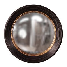 a round mirror with gold trim around it