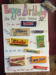 a birthday card with candy on it and an ice cream bar sign attached to it