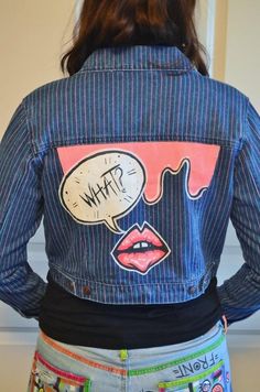 the back of a woman's jean jacket with an image of lipstick on it