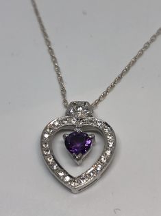 Amazing beautiful statement pendant design Main stone deep purple genuine Amethyst Gemstone Lovely handmade silver work 92.5% Sterling Silver About 16 inch long All jewelry is shipped in a nice gift box. Check out our over a THOUSAND great reviews Purple Sterling Silver Heart Cut Necklace, Fine Jewelry Heart-shaped Amethyst, Purple Heart Cut Sterling Silver Necklace, Purple Heart-cut Sterling Silver Necklace, Sterling Silver Purple Heart Pendant Necklace, Purple Sterling Silver Heart Pendant Necklace, Amethyst Heart Pendant Jewelry For Anniversary, Amethyst Heart Cut Necklace For Anniversary, Heart Cut Amethyst Necklaces For Anniversary