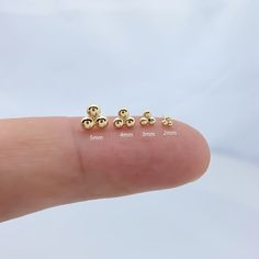 Introducing our elegant 14K gold Dot Stud Earrings, specially designed for cartilage  piercings. These exquisite studs feature a convenient push-back closure, ensuring  both comfort and security Material 14K Yellow Gold + Implant Grade Titanium Push Back Guaranteed to be genuine 14K solid gold, not plated or filled Closing method: push-back type Size: 3.5mm.5mm.7mm ★★This item is for ONE piece, NOT one pair ★★ ★★Wearable on Cartilage, Helix, Earlobes, Inner Conch or Nose★★  SHIPPING ADDRESS ●All Dainty Gold Hypoallergenic Cartilage Earrings, Dainty Hypoallergenic Gold Cartilage Earrings, Gold Minimalist Tarnish-resistant Cartilage Earrings, Dainty Gold Cartilage Earring, Dainty Gold Single Cartilage Earring, Dainty 14k Gold-filled Piercings, Dainty Gold Tarnish-resistant Piercings, Dainty Gold-plated Piercings, Gold Minimalist Tarnish-resistant Piercings