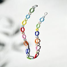 A colorful and intricate beaded rainbow necklace with a glass beaded clasp. This necklace has no metals. Nickel and lead free. Measurements & Composition: 13", 14", 15" or 16" Glass beads Cheap Playful Jewelry With Round Beads, Beads Necklace Ideas, Beaded Clasp, Beaded Rainbow, 15 Necklace, Loop Necklace, Beaded Necklace Diy, Rainbow Necklace, Handmade Jewelry Tutorials