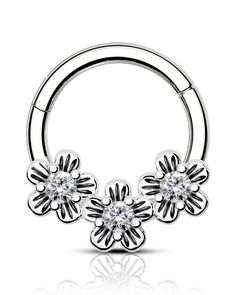 an image of a piercing ring with flowers on the end and clear crystal stones in the middle