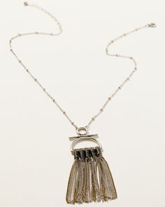 Silver-tone long chain with stationed beads. Lobster clasp closure. Mixed gold- and silver-tone fringe chain pendant design. Imported. Western Jewellery, Chain Fringe, Fringe Necklace, Pendant Design, Chain Pendant, Long Chain, Chain Pendants, Gold And Silver, Rustic Charm