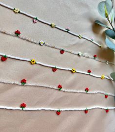 Handmade Beaded Choker  Beaded strawberries Beaded Daisies/ sunflowers   14 inches long with a 2-inch tail extender  18k plated gold findings  or  silver findings  Ships same day or next business day  CARE  Avoid getting it wet.  Keep in a dry place Beaded Choker Diy, Bead Strawberry, Beaded Strawberry, Beaded Sunflower, Strawberry Beads, Diy Choker, Strawberry Necklace, Bracelets Design, Sunflower Necklace