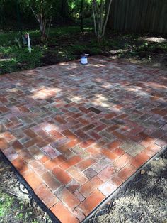 a brick patio being built in the backyard