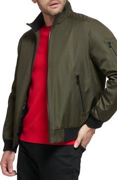 Every closet craves this edgy bomber styled with handy side pockets, a water-resistant finish and comfy ribbed trim. Front zip closure Stand collar Front zip pockets Ribbed cuffs and hem Water resistant Lined 100% polyester Machine wash, line dry Imported Nylon Track Jacket With Ribbed Cuffs For Fall, Fall Nylon Track Jacket With Ribbed Cuffs, Nylon Track Jacket With Zipper Closure For Fall, Casual Nylon Outerwear With Zip Cuffs, Green Outerwear With Zip Cuffs For Fall, Fall Nylon Track Jacket With Zipper Closure, Green Fall Outerwear With Zip Cuffs, Casual Track Jacket With Zipper Closure For Outdoor Activities, Fall Nylon Track Jacket With Zip Cuffs