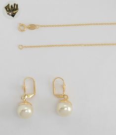 Description: -Earrings, Pendant and Necklace Pearls Set. ( not natural pearl) -Material: 18k Gold Filled (BGF). -Chain Width: 1mm. -Beads: 12mm. -Available in Size: 18". Elegant Gold Pearl Necklace With Matching Earrings, Dainty Gold Jewelry Sets For Formal Occasions, Formal Dainty Gold Jewelry Sets, Gold Jewelry Sets With Pearl Pendant For Formal Occasions, Formal Jewelry Sets With Round Pearl Pendant, Formal Round Jewelry Sets With Pearl Pendant, Elegant Round Pearl Chain Jewelry Sets, Formal Jewelry Sets With Pearl Pendant, Elegant Pearl Chain Jewelry Sets