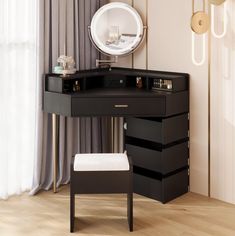 a black vanity with mirror and stool in front of it