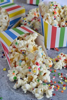 popcorn with sprinkles in striped paper cups