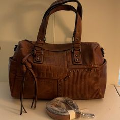 Soft Faux Leather Bag Has Lots Of Storage Pockets, 1-Large Zip Pocket Outside 2-Large Zip Pockets And 1-Large Storage Pocket Inside, 2-Large Pockets On Outer Sides And Comes W/ Detachable Shoulder Strap, Zip Closure On Top Brown Satchel With Cell Phone Pocket, Brown Shoulder Bag With Cell Phone Pocket For Errands, Hobo Satchel Bag With Cell Phone Pocket For Errands, Rectangular Satchel With Cell Phone Pocket For Errands, Hobo Shoulder Bag With Cell Phone Pocket For Errands, Leather Satchel With Cell Phone Pocket And Double Handle, Brown Hobo Shoulder Bag With Cell Phone Pocket, Brown Hobo Bag With Cell Phone Pocket, Tote Shoulder Bag With Cell Phone Pocket For Errands