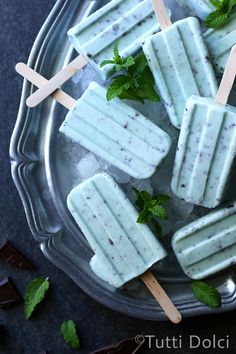 mint and chocolate pops on a plate with toothpicks in the middle, ready to be eaten